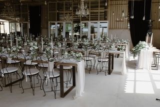 banquet rows of small vases and candles copy