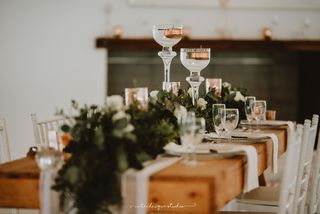 floral runner with tall stemmed mia candle holders in the centre copy