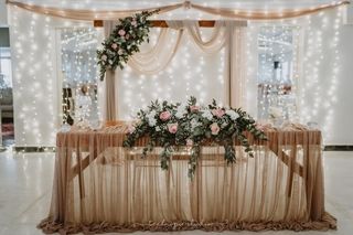 arch and waterfall fairy lights behind 2 pax wooden main table copy 2