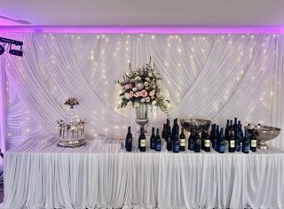 modern draped backdrop and table draped with raised areas