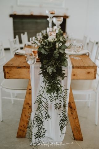 white mesh runners and foliage on ends of tables for 8 ax